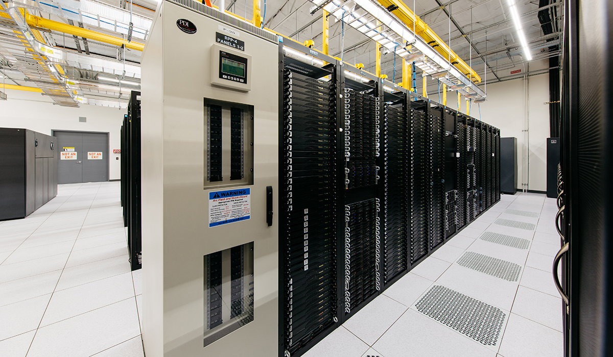 Server room with cabinets filled with servers